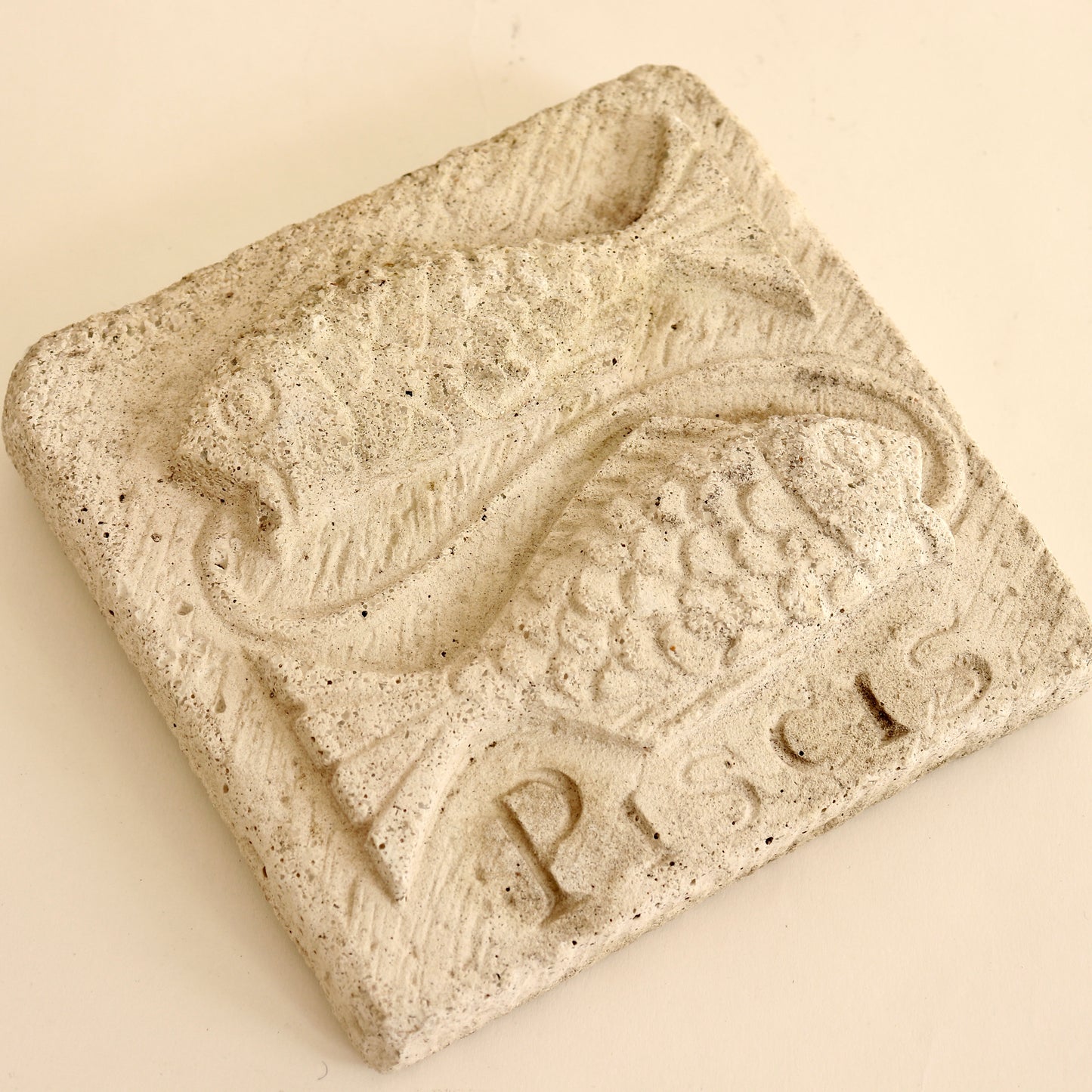 cast stone fish plaque piscis inscription