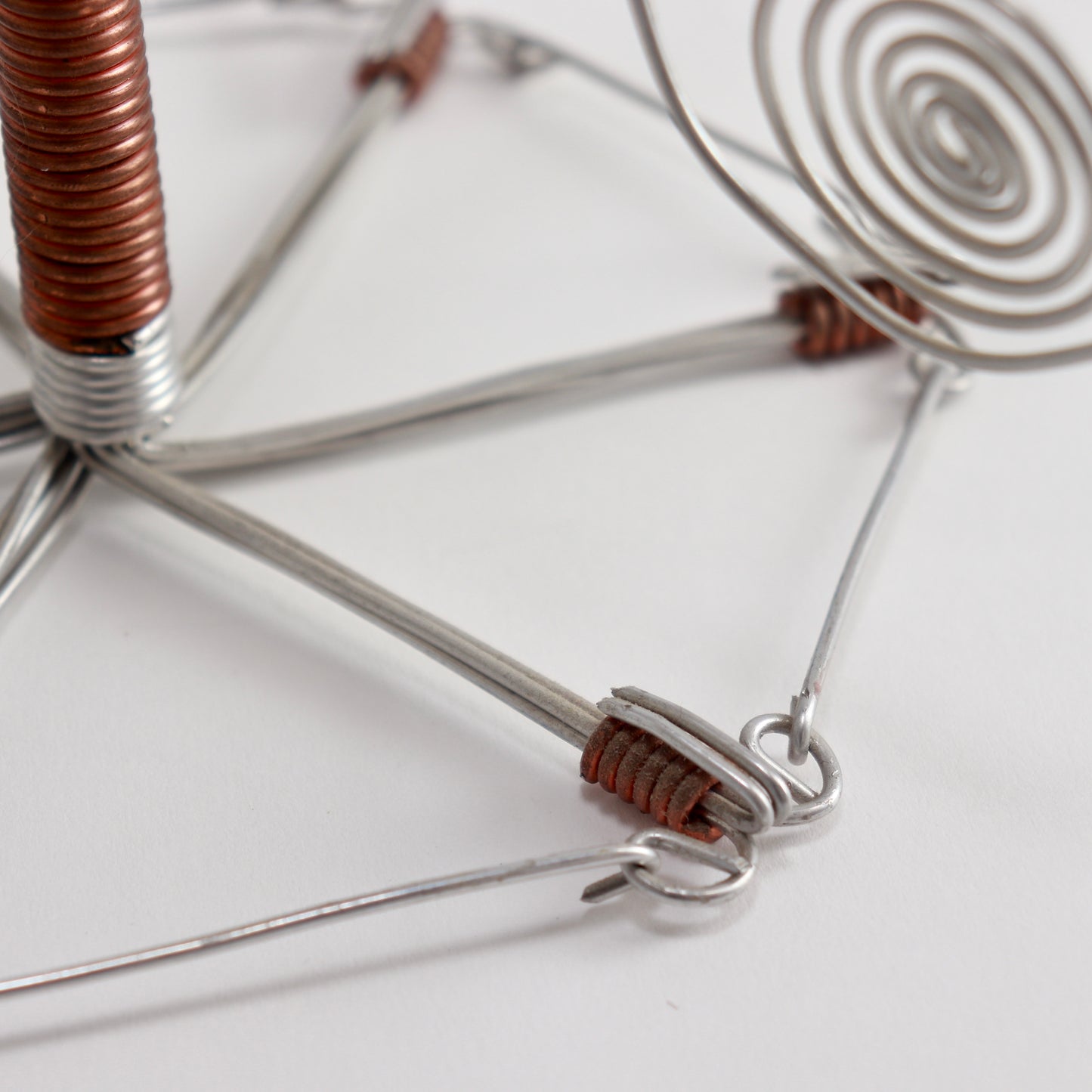 Folk art metal spiral candle stand