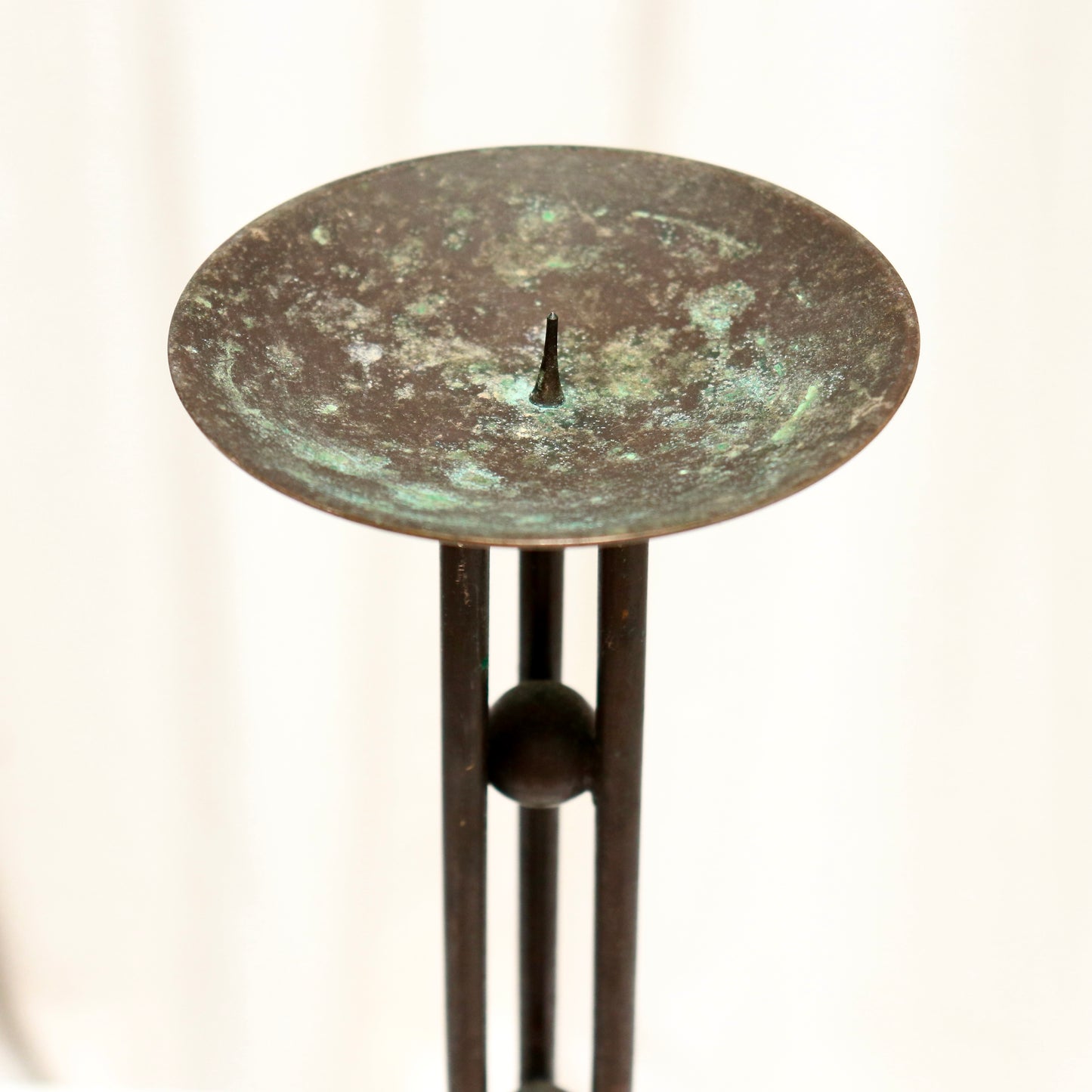 Pricket dish top with green oxidation.