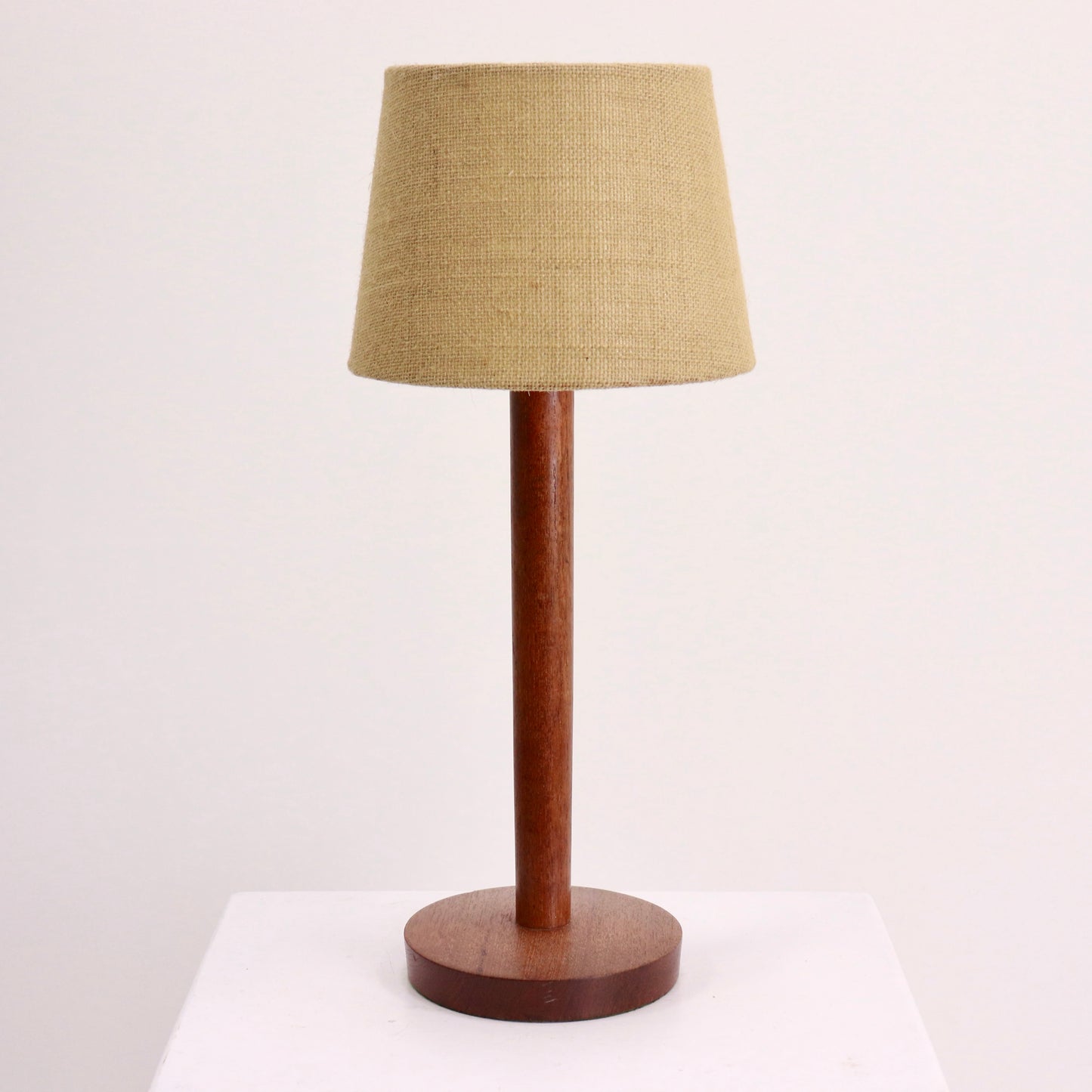 “Mid-century teak table lamp with hessian shade, front view”