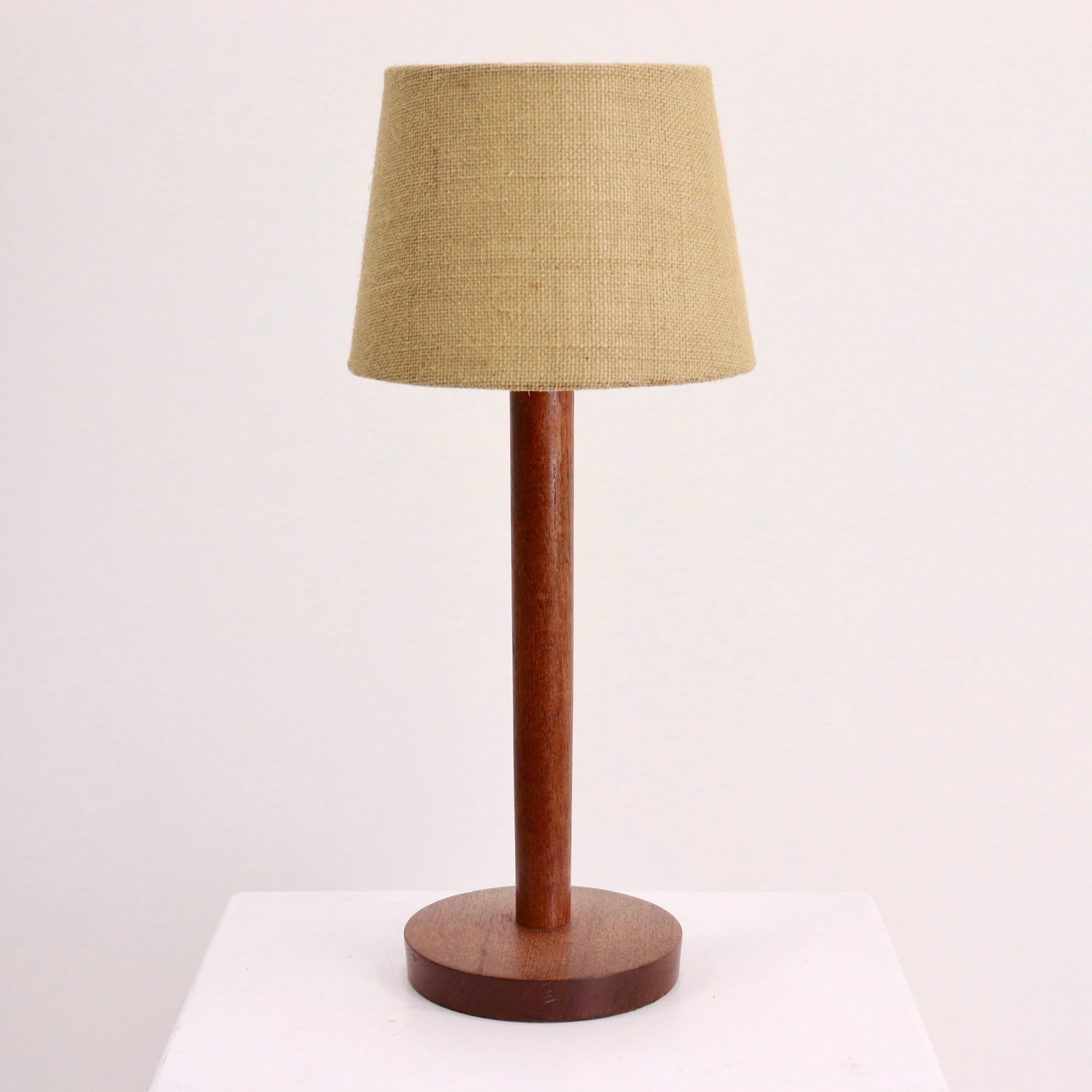 “Mid-century teak table lamp with hessian shade, front view”