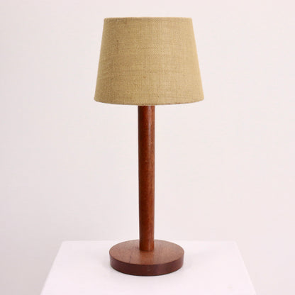 “Mid-century teak table lamp with hessian shade, front view”