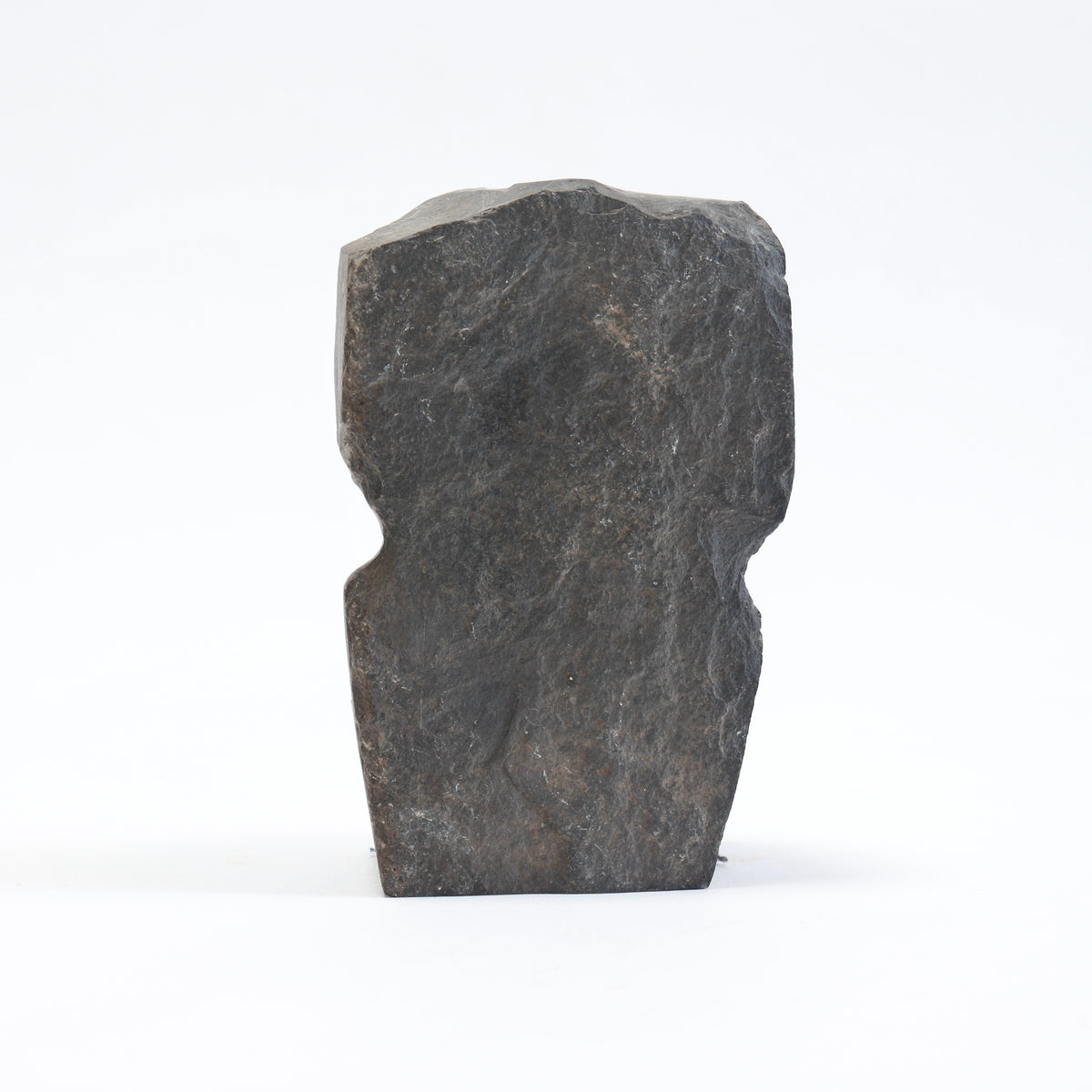 Rear view of the portrait bust showing the slate’s rough surface and irregular outline.