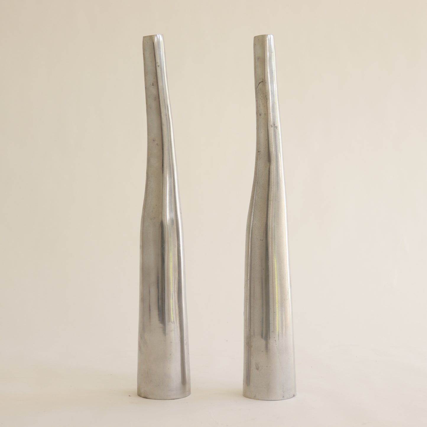 Sculptural aluminium vases with tapered silhouette