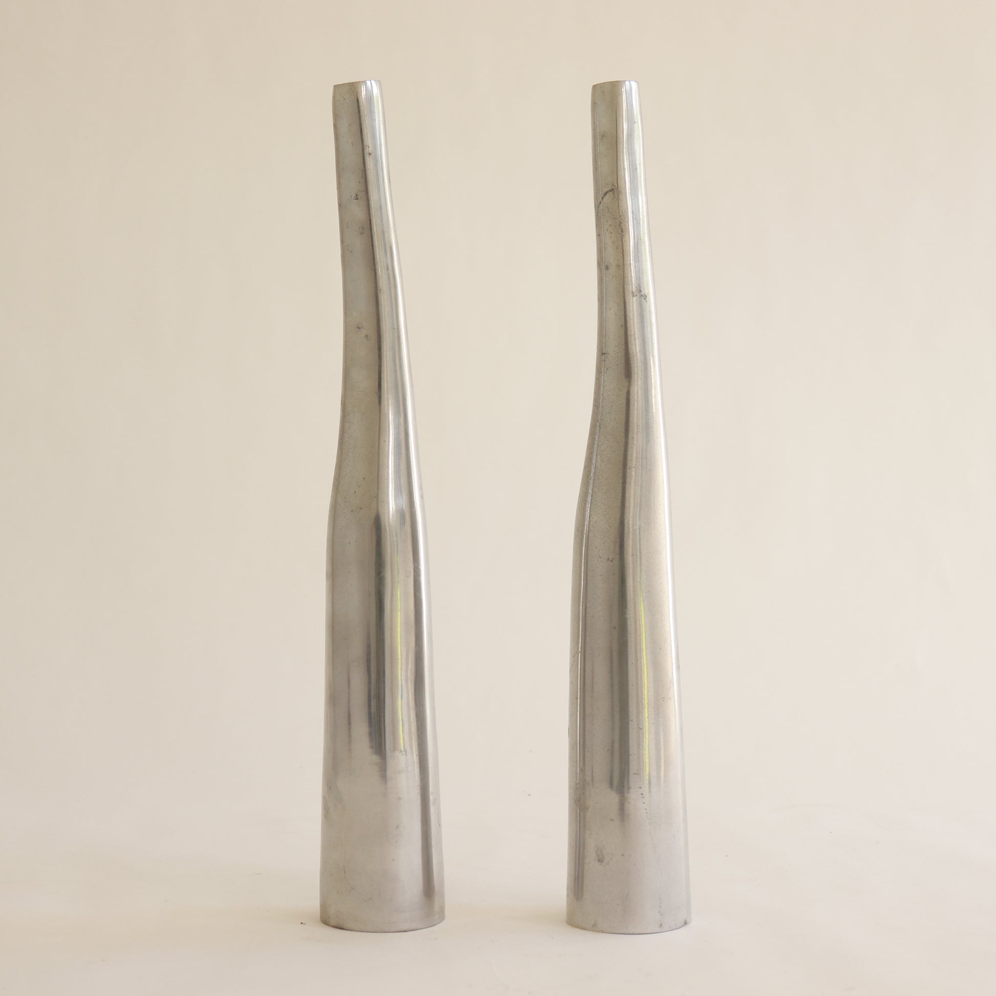 Sculptural aluminium vases with tapered silhouette