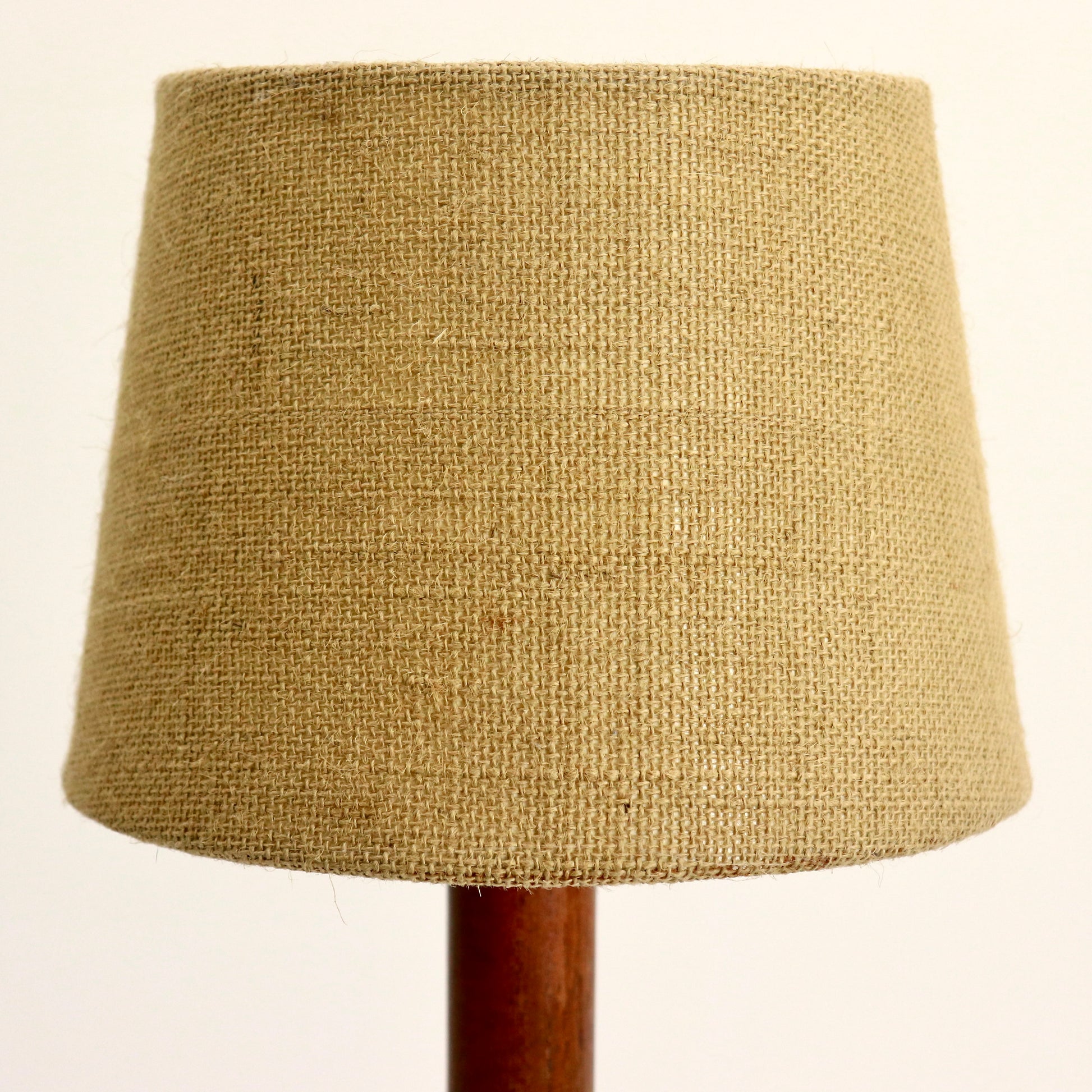 “Close-up of hessian lampshade texture on teak lamp”