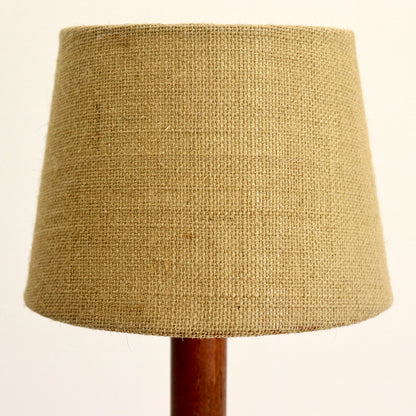 “Close-up of hessian lampshade texture on teak lamp”