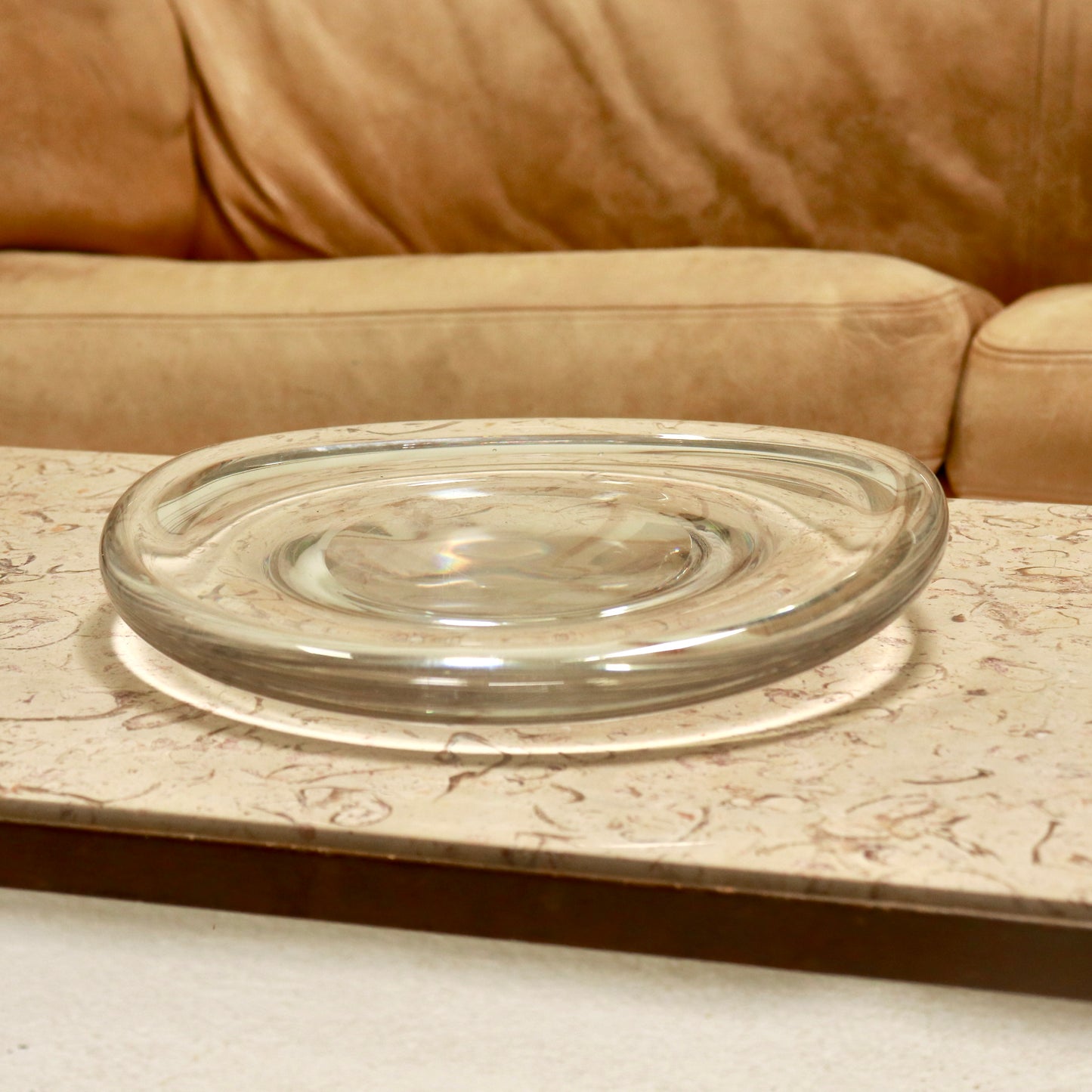 Clear bulbous glass dish with recessed centre