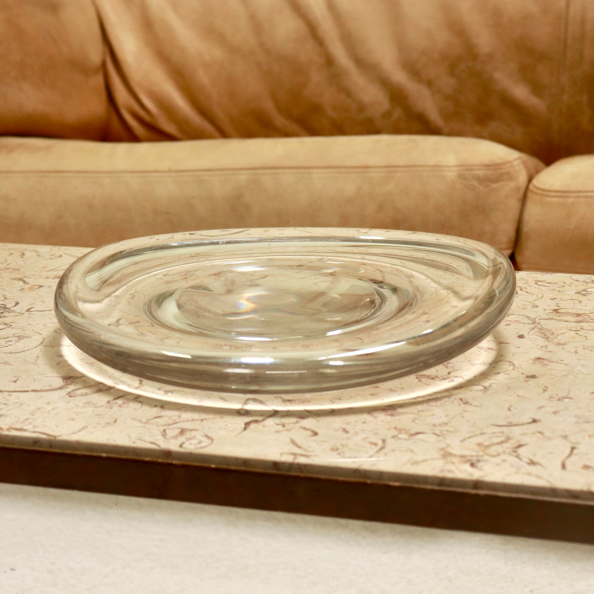 Clear bulbous glass dish with recessed centre