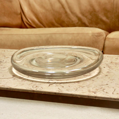 Clear bulbous glass dish with recessed centre