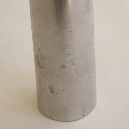 Aluminium vase detail with oxidation and wear