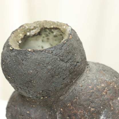 Top opening of hand-formed ceramic vessel