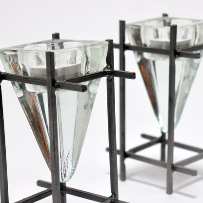 Sculptural steel frame candle holders with inverted glass prism