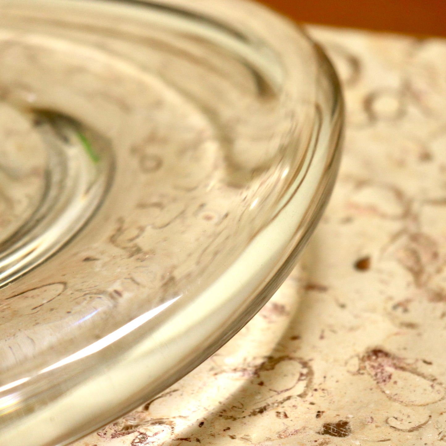Close-up of rounded glass rim and clarity