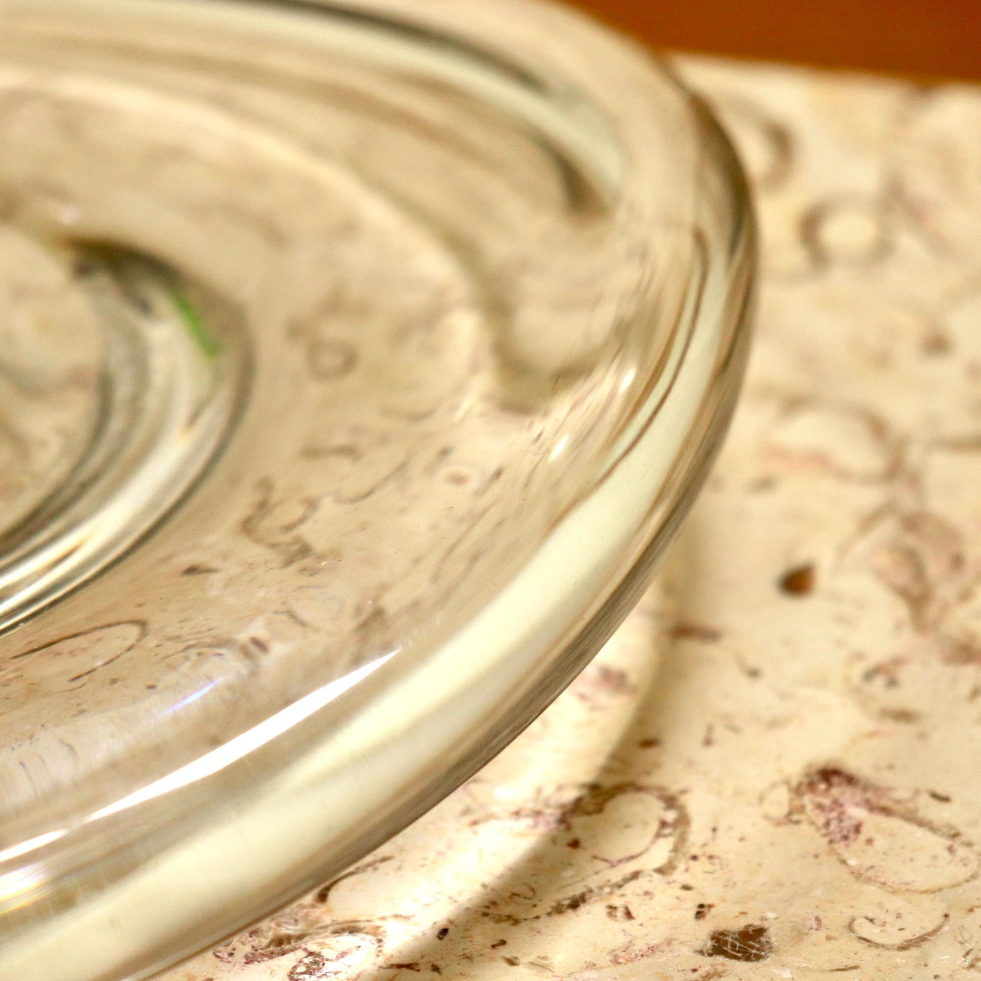 Close-up of rounded glass rim and clarity