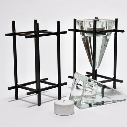Architectural steel candle holders with glass prism inserts
